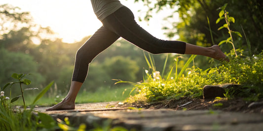 Person stretching outdoors to support cartilage with a joint health supplement.